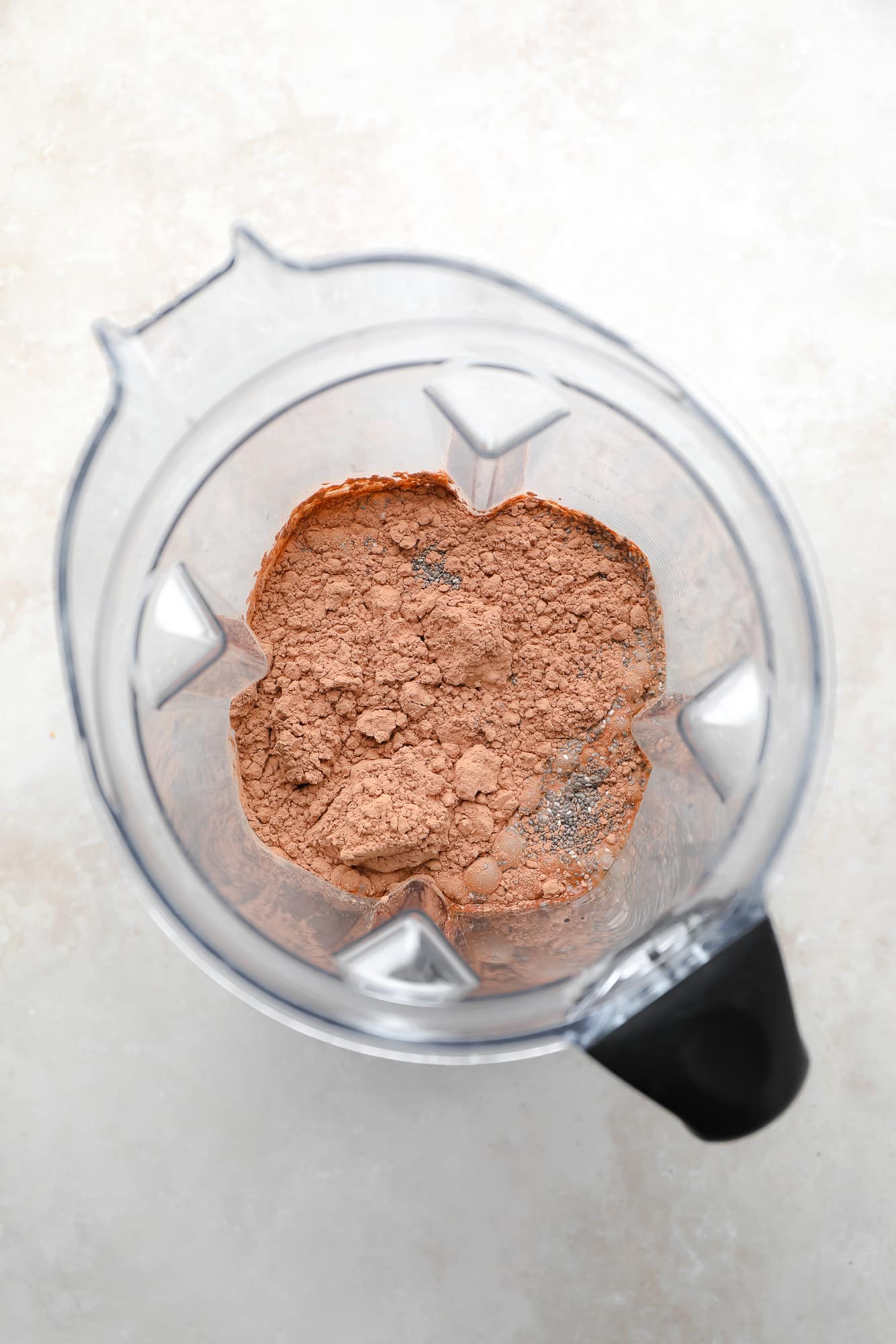 Ingredients for Chia chocolate gut in a blender.
